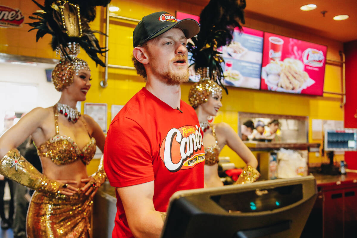 Vegas Golden Knights center Jack Eichel takes orders from Golden Knights fans inside of Raising Canes on Friday, June 16, 2023, in Summerlin. Eichel sold chicken to fans for an hour to promote the restaurant and celebrate winning the Stanley Cup. (Madeline Carter/Las Vegas Review-Journal)
