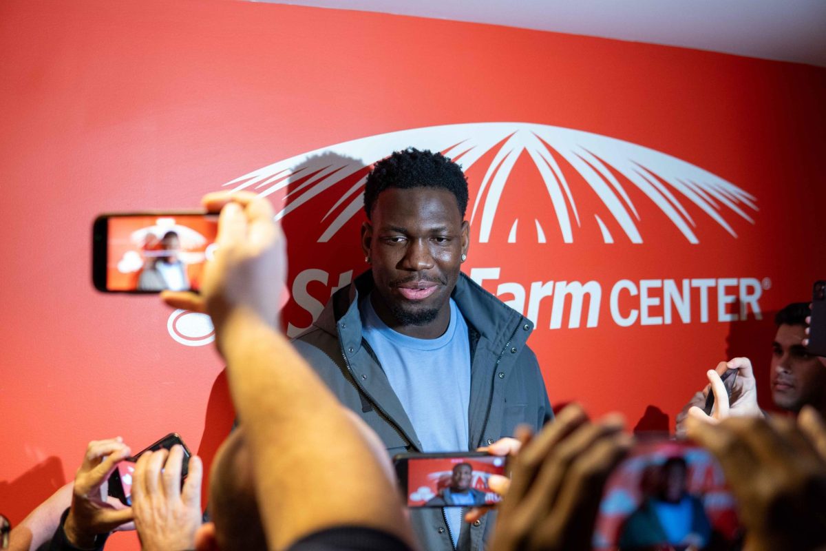 Former Illini center Kofi Cockburn speaks to local media, including The Daily Illini, ahead of his honored jersey ceremony on Feb. 11.