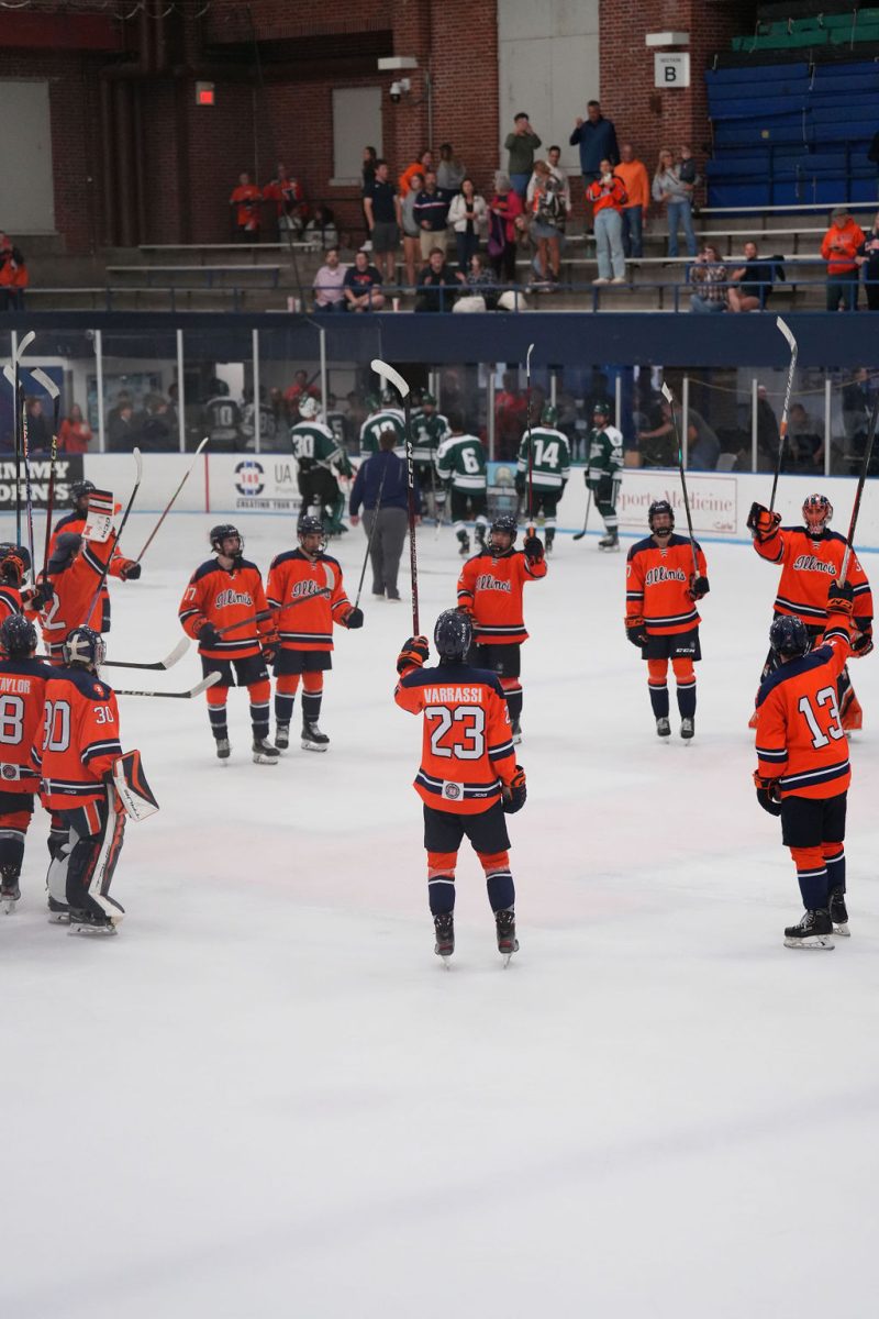 The Illinois club hockey team raises their sticks in celebration after a match against Michigan State on Sept. 20, 2024.