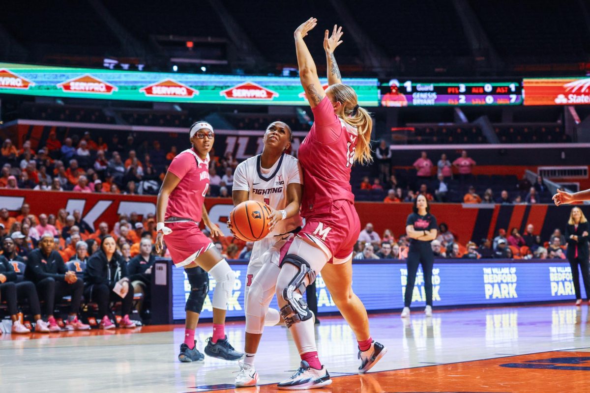 Fifth-year guard Genesis Bryant fights her way to the hoop against a Maryland defender on Feb. 12, 2024.