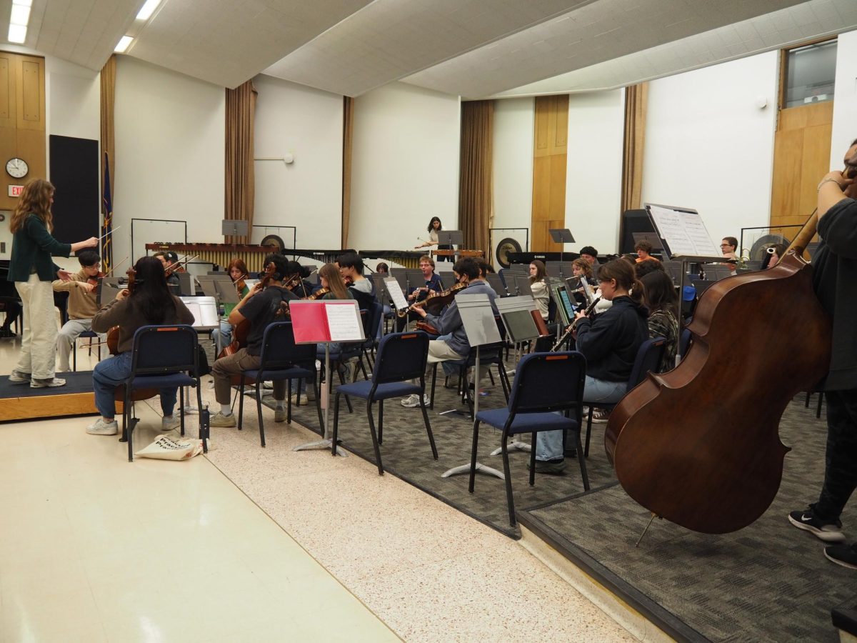 Julia Olson, Film Score Orchestra's music director and co-president, conducts FSO rehearsal in the Harding Band Building on Feb. 10.