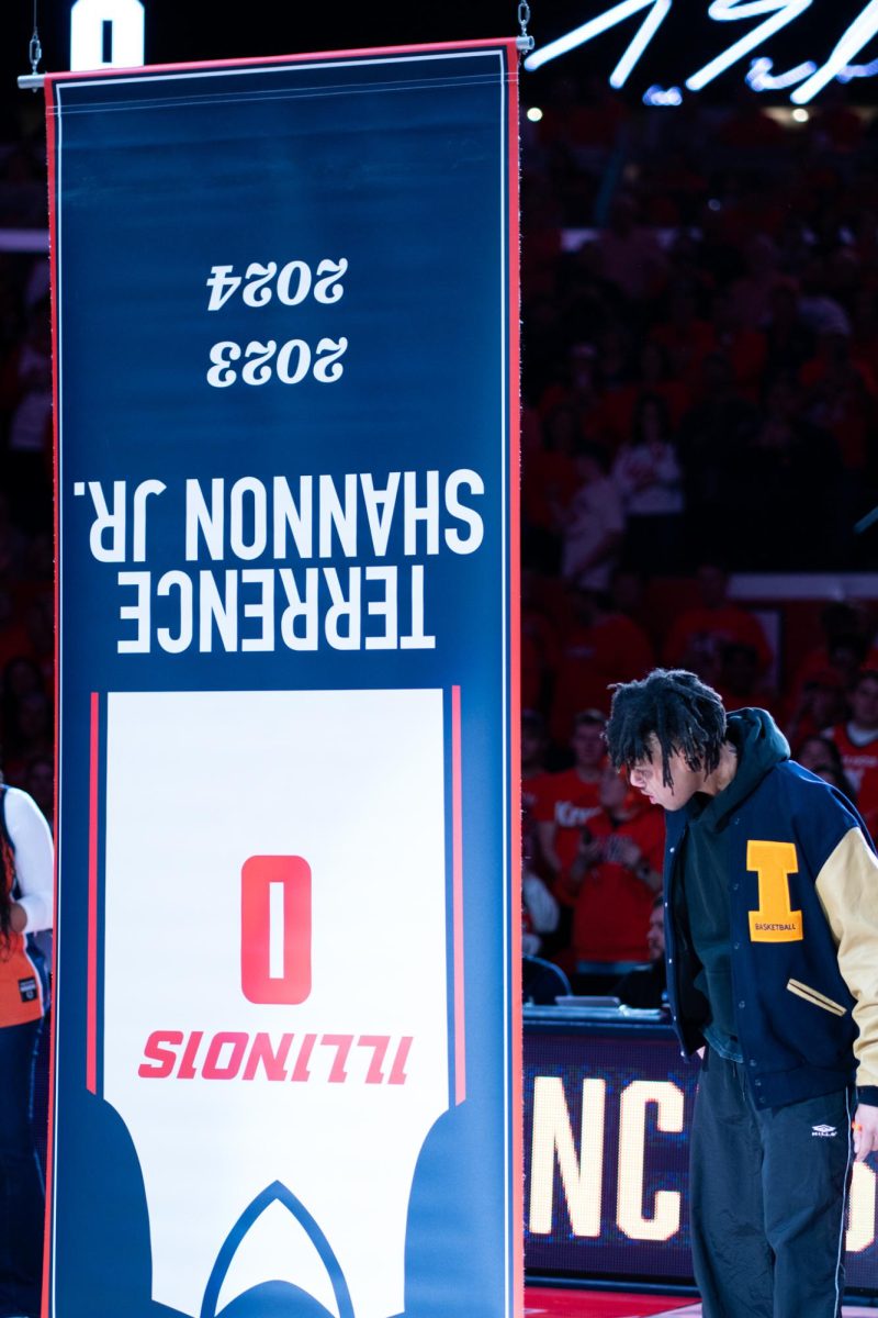 Terrence Shannon Jr. reacts to his jersey banner being revealed upside down on Feb 15.