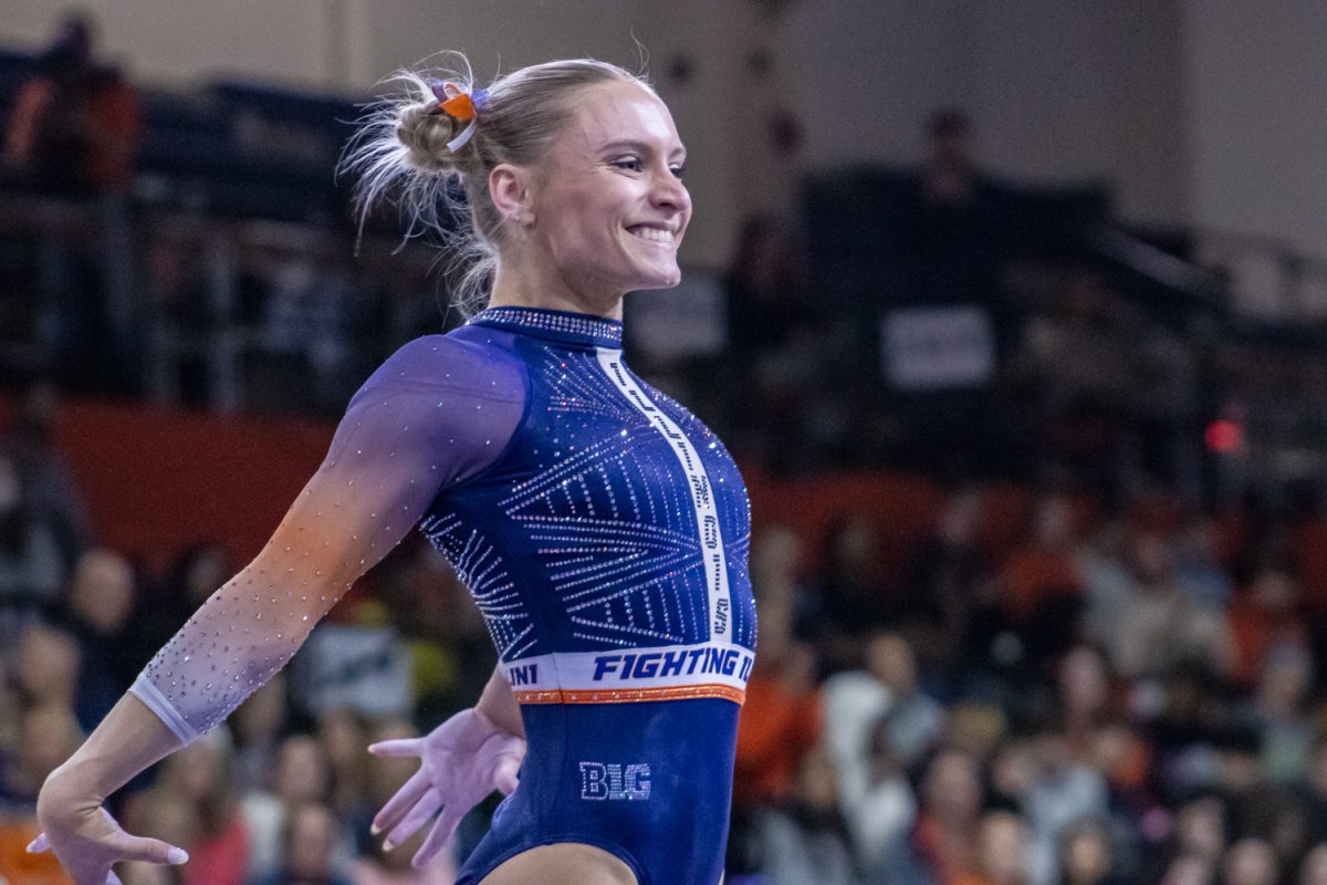 Senior Emmalise Nock performs her beam routine during a meet against Ohio State on Feb. 7. Illinois upset Ohio State with a team score of 196.150-195.475.