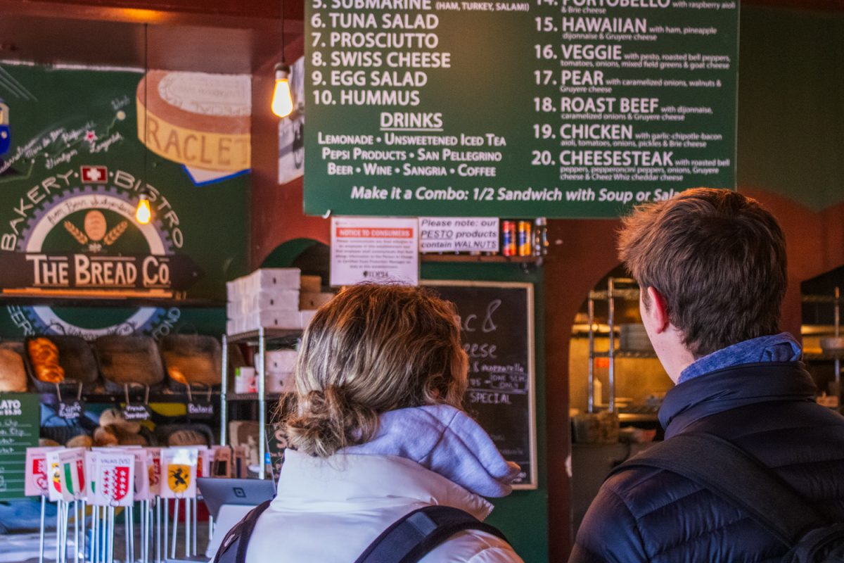 Two customers look at the menu at The Bread Company in Urbana on Valentine's Day, Feb. 14. The restaurant is known for its fresh-baked bread and cozy, rustic vibes.
