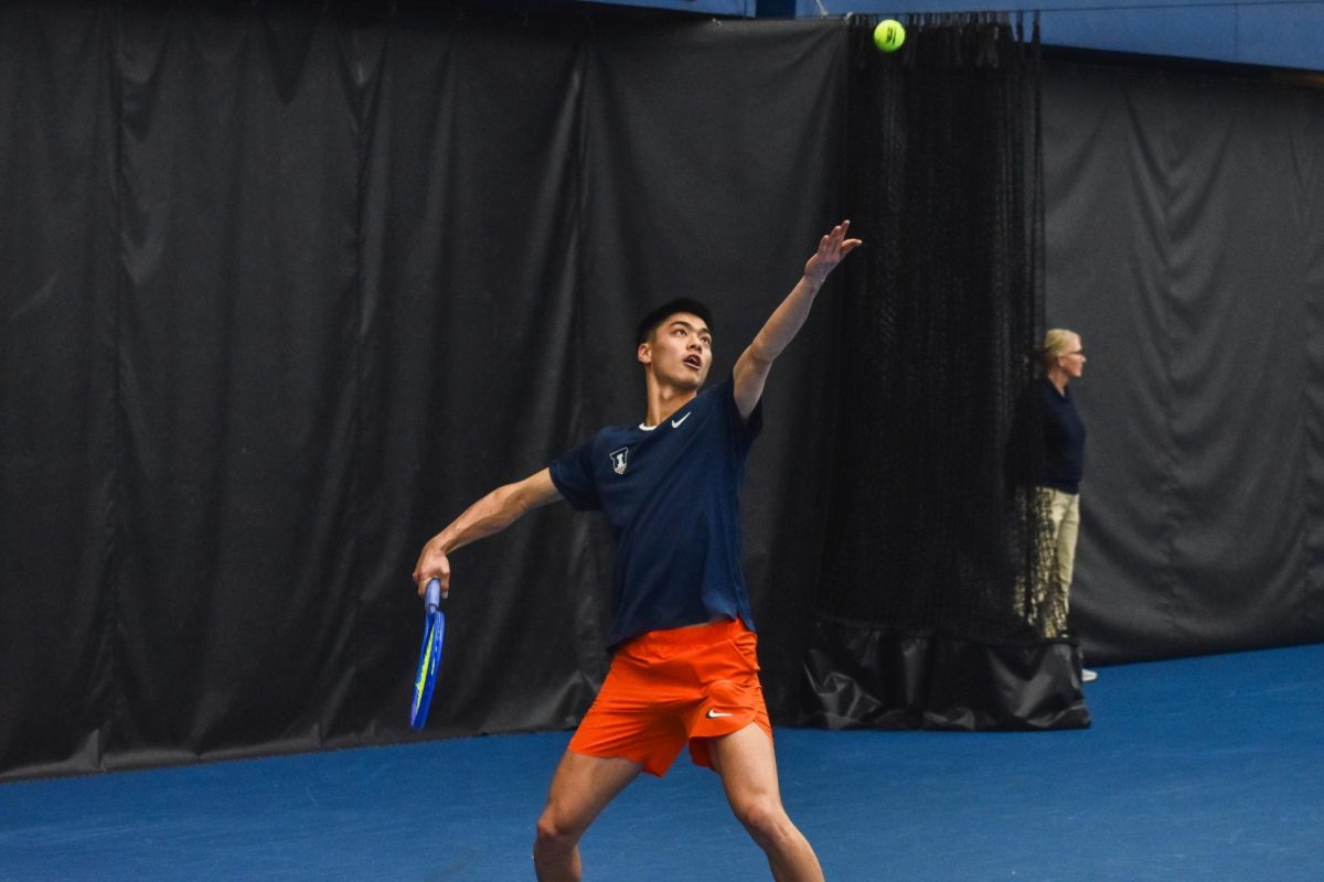 Senior Kenta Miyoshi prepares to serve during the team’s match against Clemson on Feb. 15. 