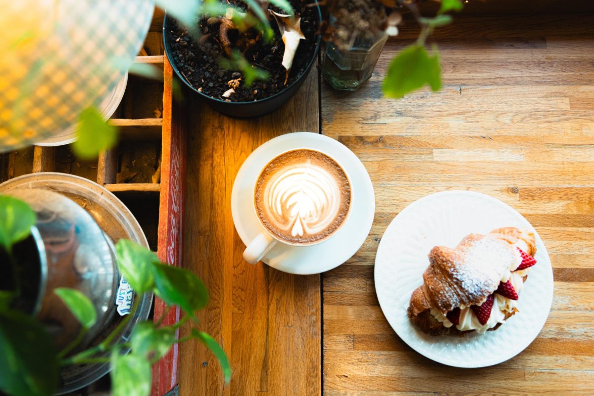 Various types of greenery and foliage adorn every corner of the cafe.