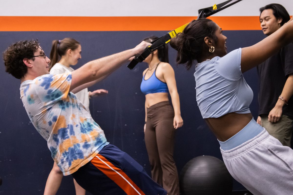 Students practice pull-up exercises at the UIUC Calisthenics Club meeting on March 1. The club meets in the ARC weekly for group workouts that accomodate members of all skill and strength levels.