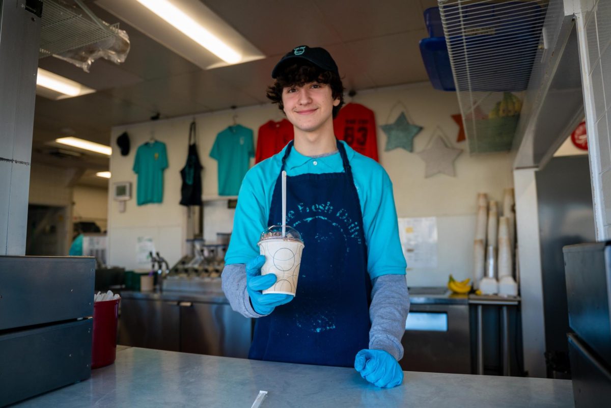 A Jarling's employee hands the customer a chocolate milkshake through the window on Mar. 2.