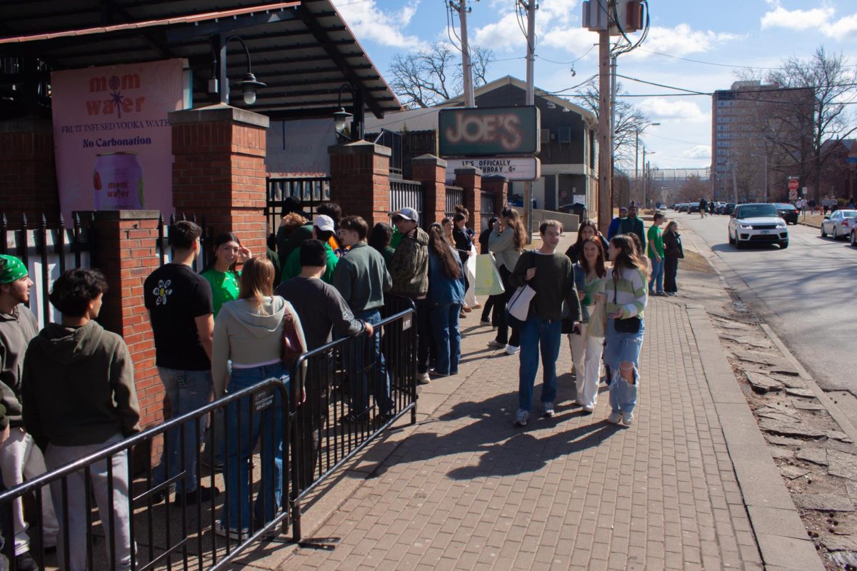 A line forms outside a packed Joe's Brewery on Saturday afternoon during Unofficial weekend.
