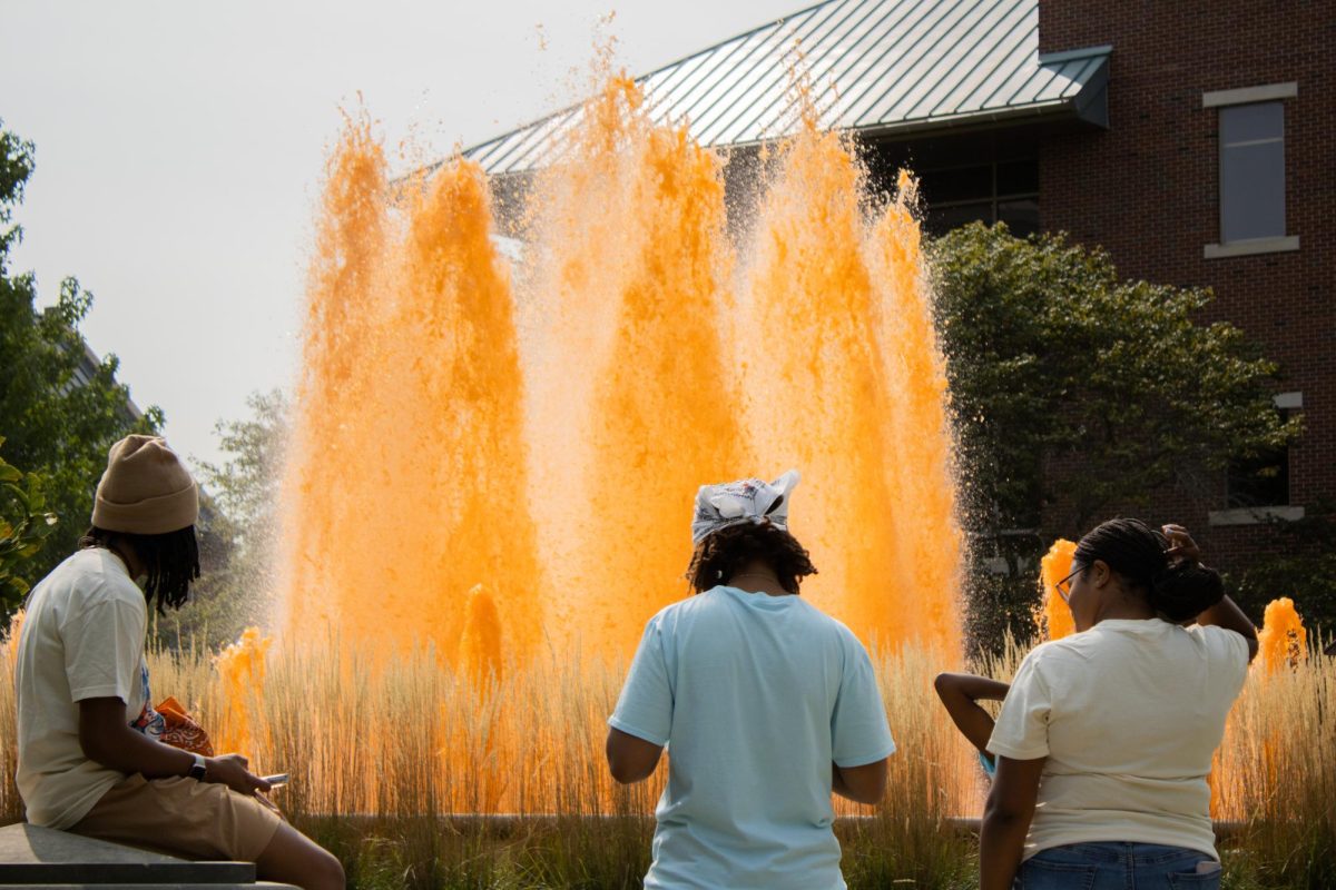 The fountain at Alice Campbell Alumni center is dyed orange for Homecomeing Kickoff on Oct. 8.