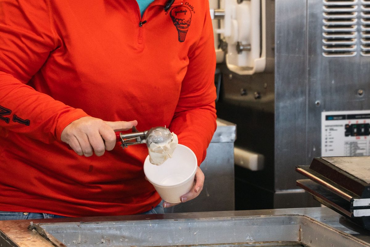 A staff member of Jarling's Custard Cup scoops vanilla custard to make a Fudge Sunday on Mar. 3.