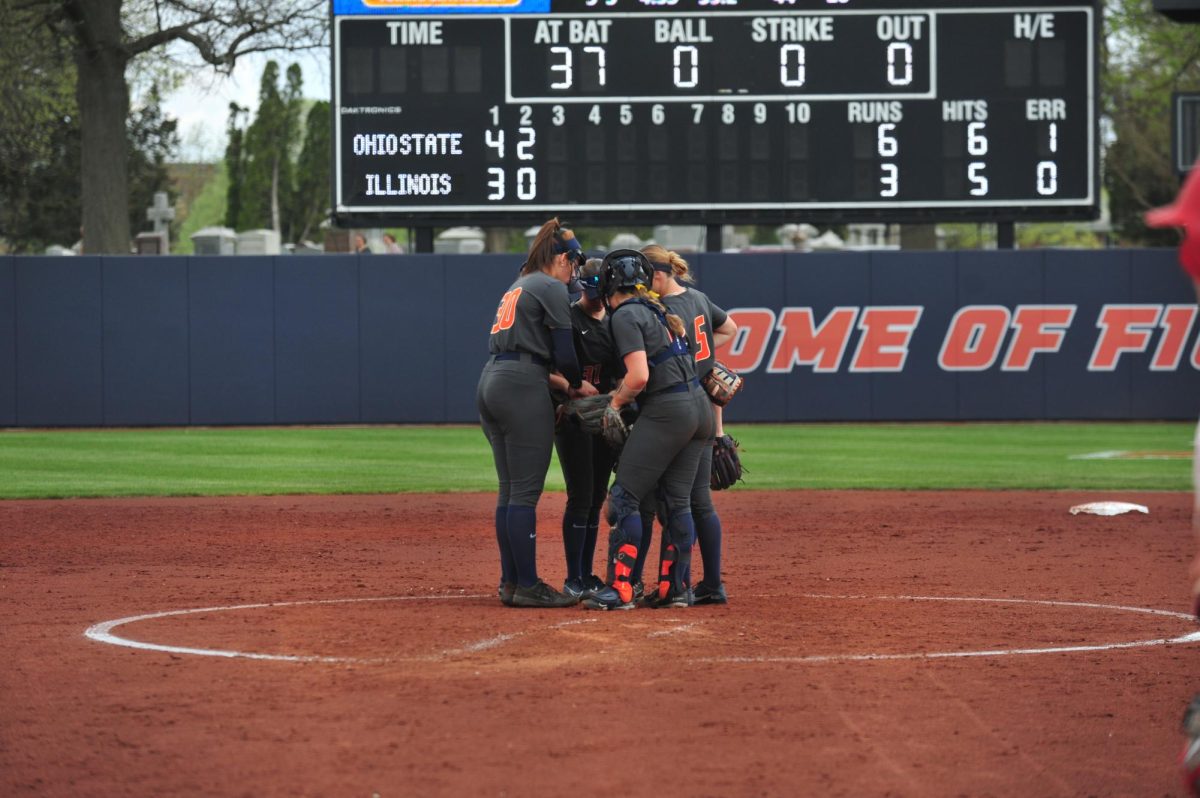 Illinois softball meets on the mound during a game against Ohio State on April 15, 2023. 