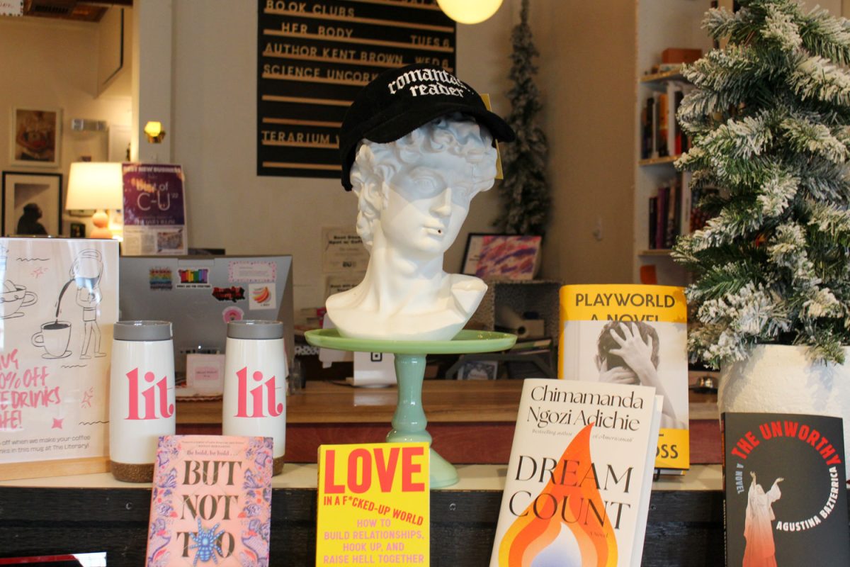 Book and The Lit merch surround a bust within the entrance of the cafe book store on Feb. 28.