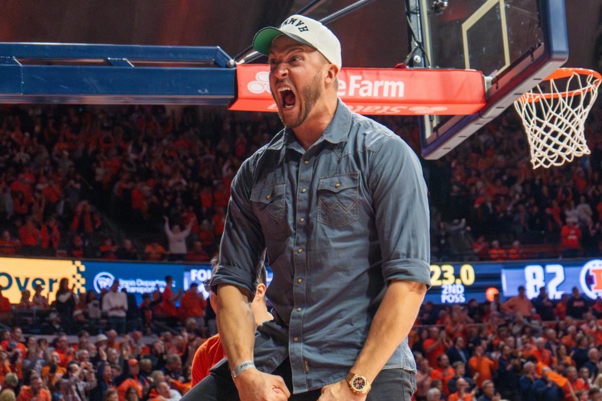 Illinois graduate and former NBA player Meyers Leonard screams with excitement during the Illinois vs. Purdue basketball game on March 7. Illinois went on to win the game 88-80