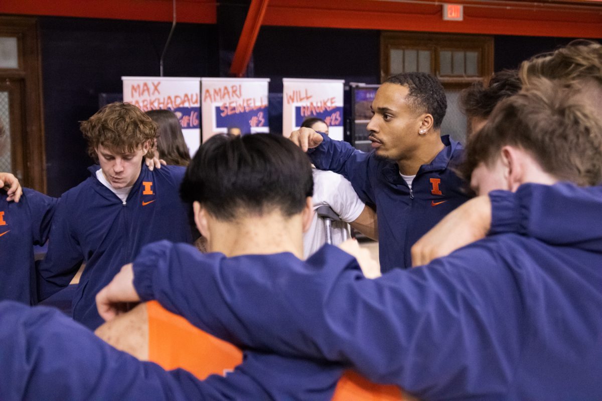 The Illinois men's gymnastics team huddles up after their senior day meet on March 8. Illinois lost the meet to Penn State 312.550-321.750.