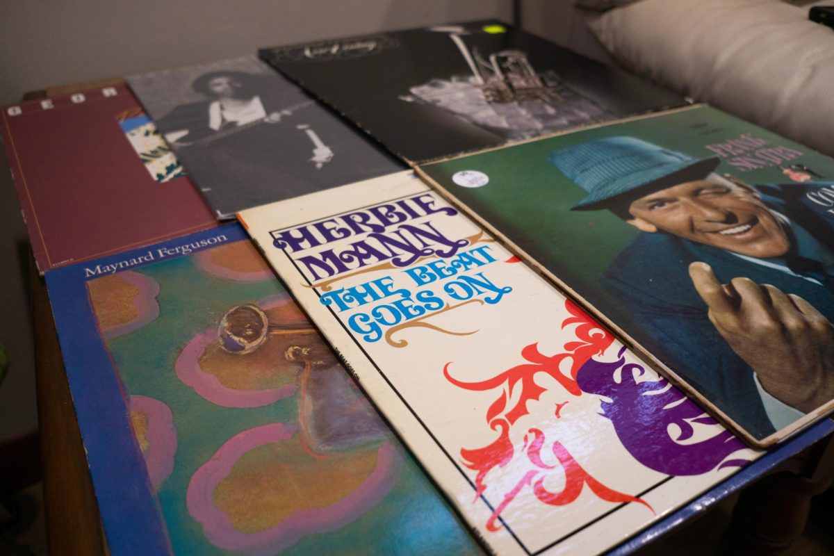Six classic and contemporary jazz vinyl records are scattered on a table, 2023.