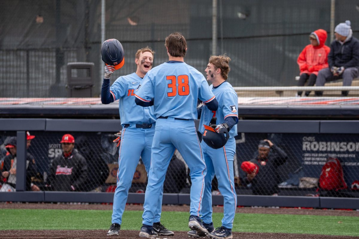 Members of Illinois infield celebrate during its game against Maryland on April 6th.