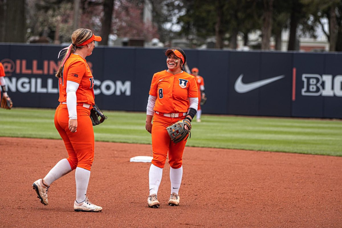 (L-R) Sophomore infielder Eileen Donahue and freshman utility player Keirys Click talk on the infield during a game against the Michigan State Spartans on April 13th.