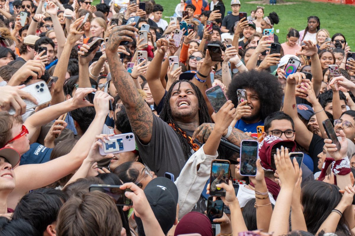 Waka Flocka Flame takes a selfie with a student's phone during Spring Jam 2025 on Sunday.