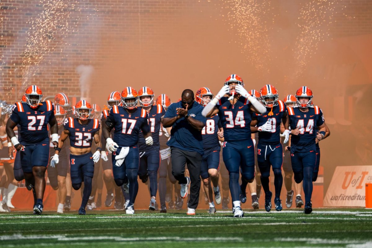 The Illinois football team runs onto the field filled with energy at the start of the Illinois v Purdue football game on Oct. 12. in Memorial Stadium