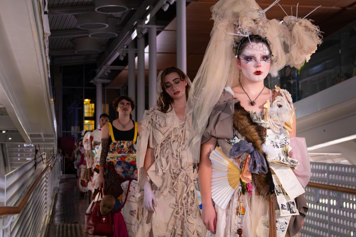Models showcase outfits on the runway during the Circular Fashion Expo held on Dec. 7, 2024 at the Siebel Center for Design. The show emphasized creativity and sustainability, featuring designs made from upcycled materials.