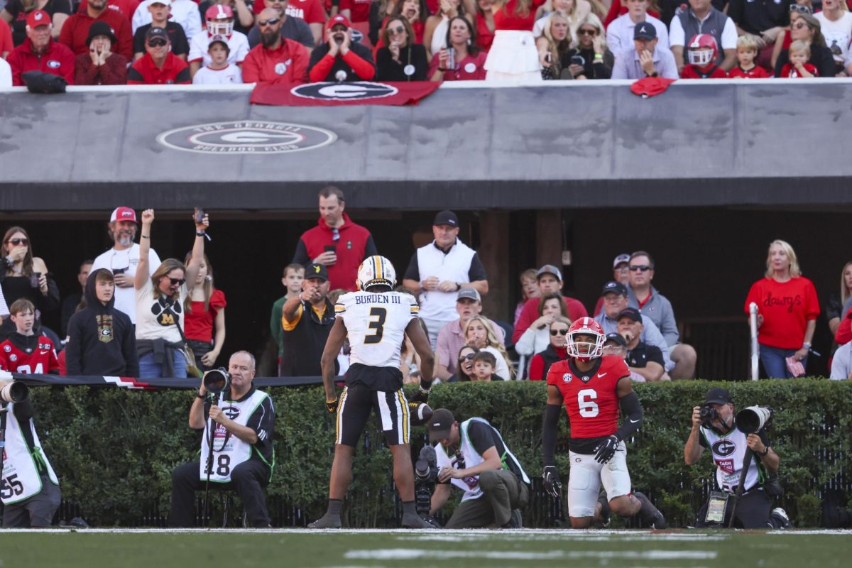 Missouri wide receiver Luther Burden III (3) reacts after scoring a 39-yard touchdown reception against Georgia defensive back Daylen Everette (6) during the first quarter at Sanford Stadium, Saturday, November 4, 2023, in Athens, Ga.