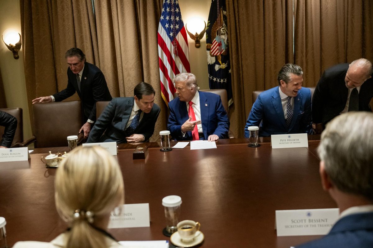 President Donald Trump speaks to U.S. Secretary of State Marco Rubio at a cabinet meeting on April 10.