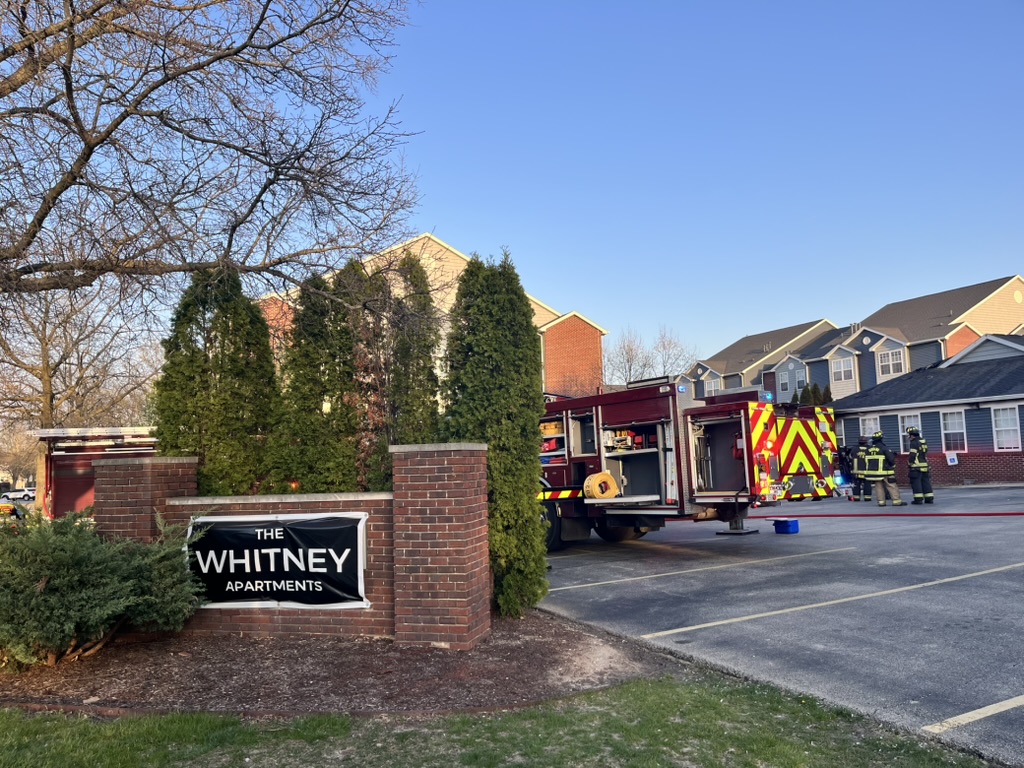 Fire engines respond to a structure fire at The Whitney Apartments on April 17.