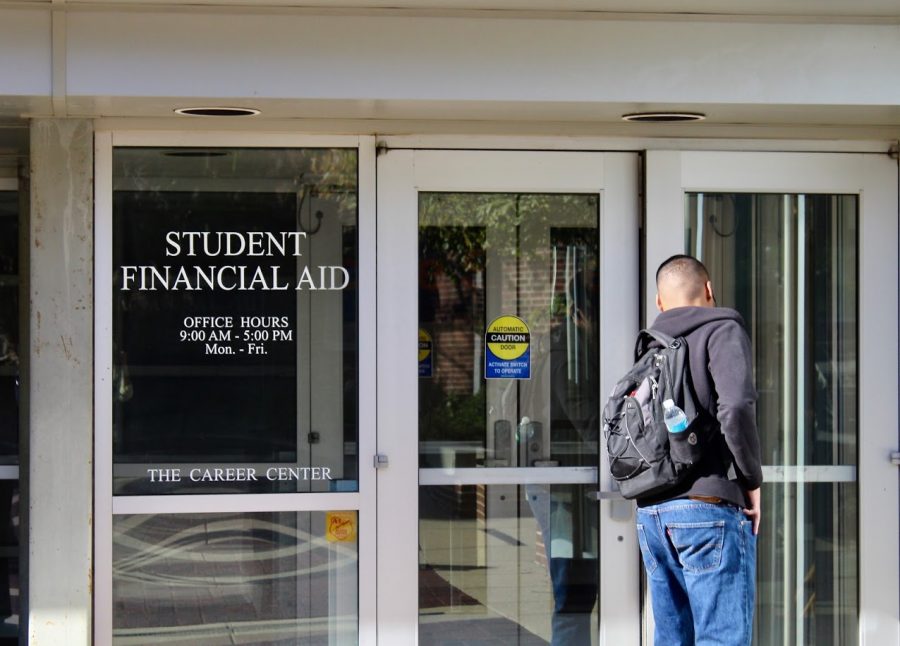 An Illinois student enters the Office of Student Financial Aid on Oct. 22, 2018.