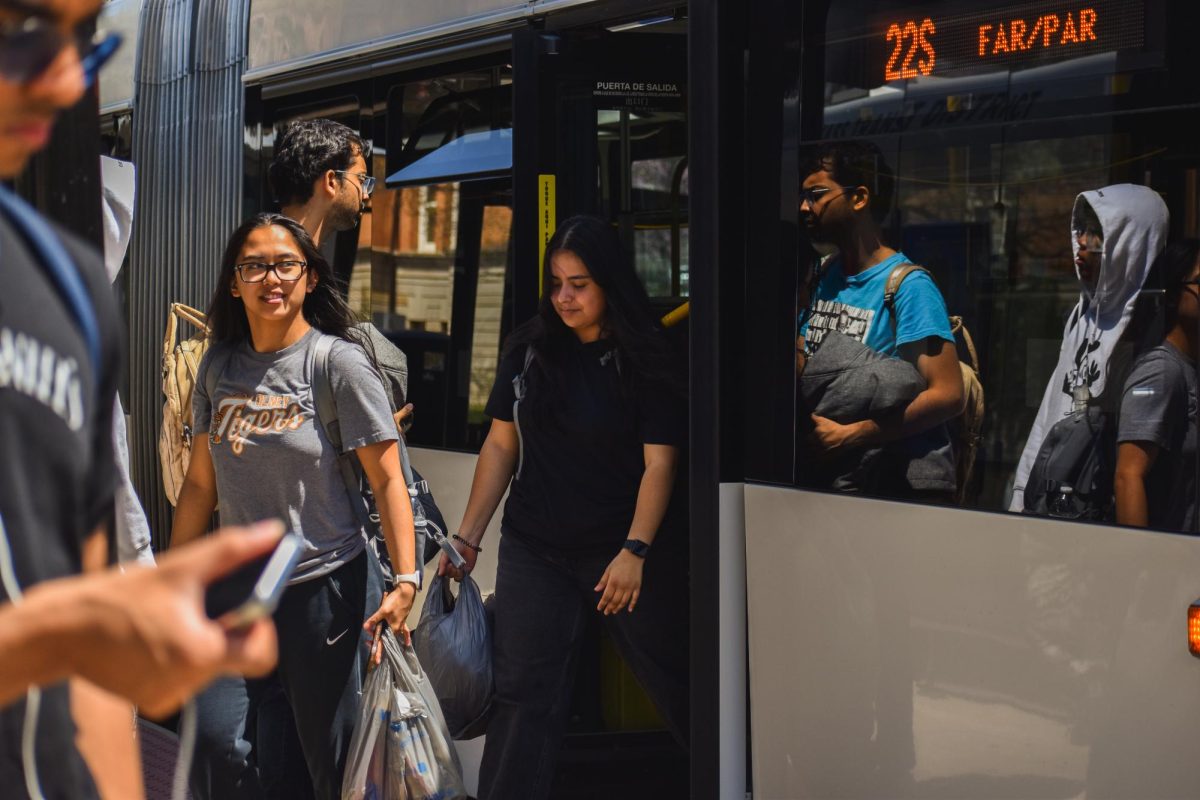 Students step off the 22S bus on a sunny Tuesday, navigating around the campus using the MTD transit system on April 24.