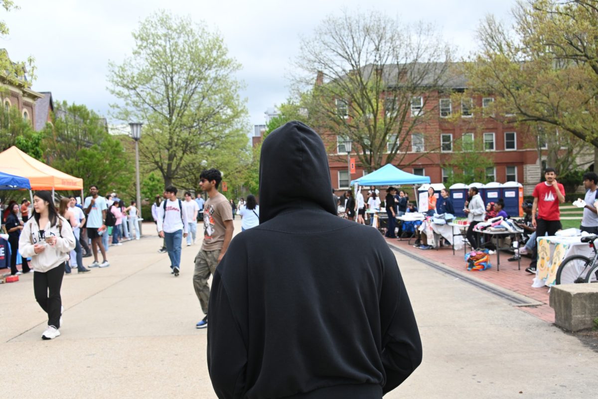 Freshman in college walks around alone, after having troubles making friends on a cloudy Friday, April 25.