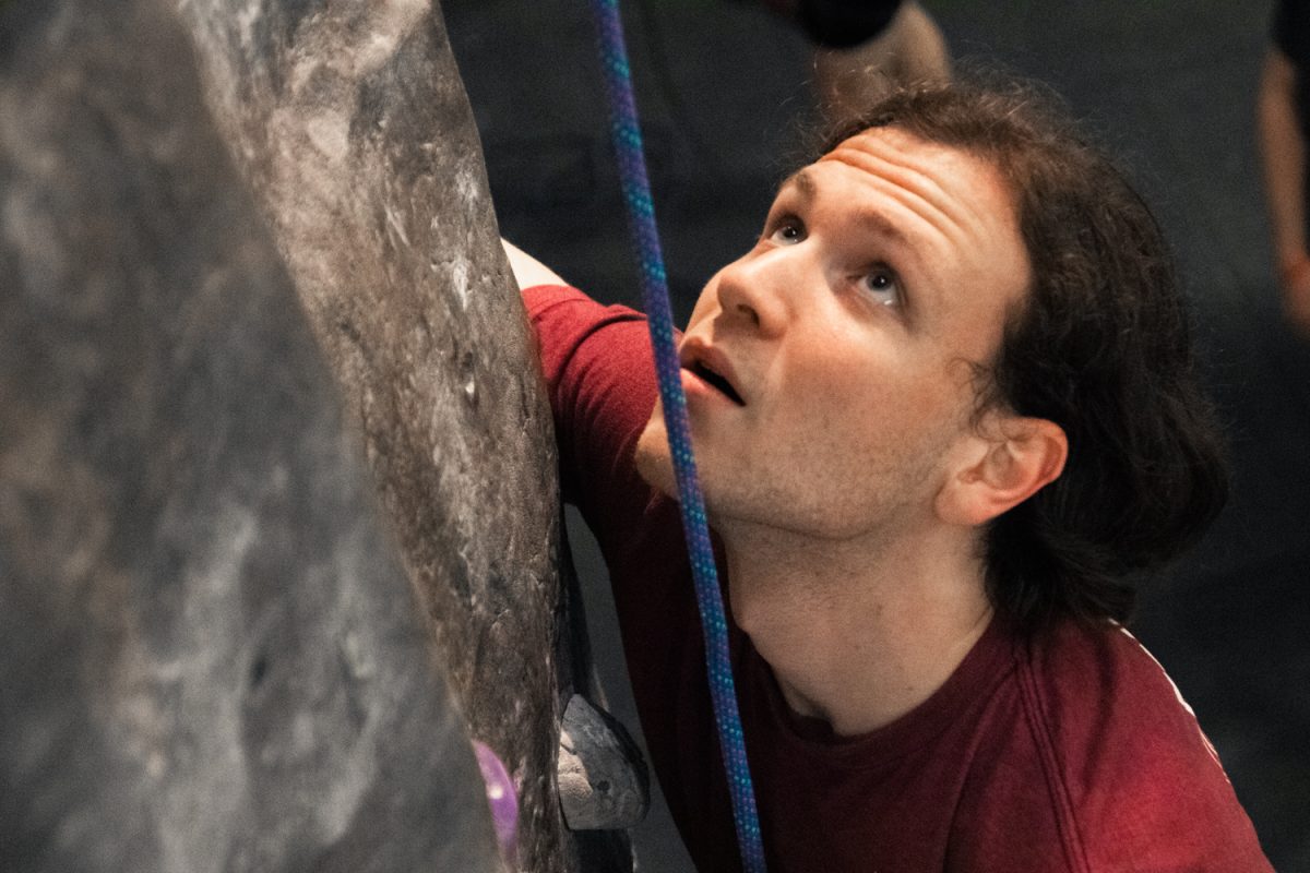 David Mengel, a senior in Engineering, scales the rock wall in the Activities and Recreation Center on April 30. The Illinois Climbing Club has open hours for casual climbers as well as a competitive team.