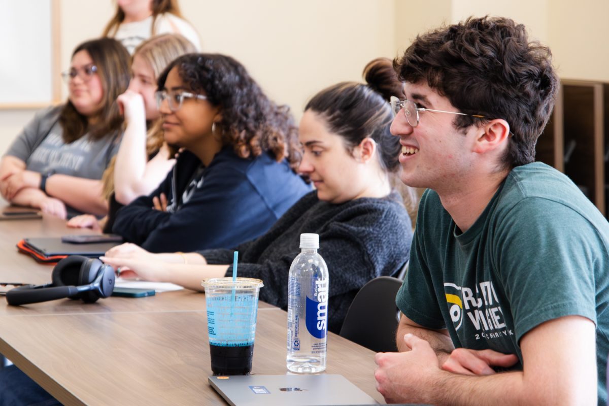 Students laugh watching their peers' presentation during FSHN 120: Contemporary Nutrition on April 30. The class, taught by Toni Gist, satisfies a life sciences credit and covers the basics of human nutrition and health.