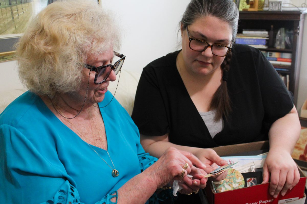 Courtney Mann with her client Pat Schutt's at Schutt's apartment in Savoy on May 2.