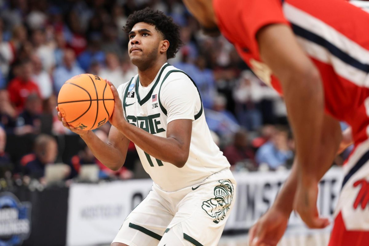 Michigan State guard Jase Richardson (11) shoots during the Sweet 16 at State Farm Arena in Atlanta, Georgia, on Friday, March 28.