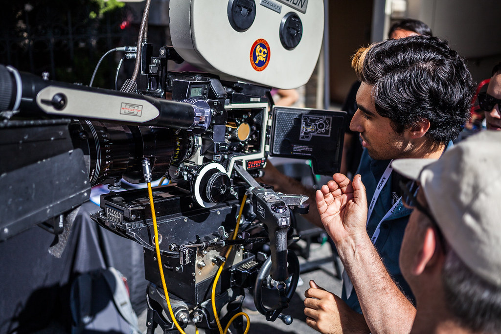 A camera operator loads film into a Panavision Film Camera.