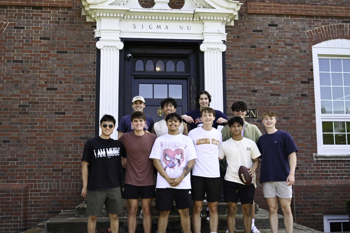 Members of Sigma Nu outside their fraternity house on April 23. The Illinois chapter was founded in 1902.