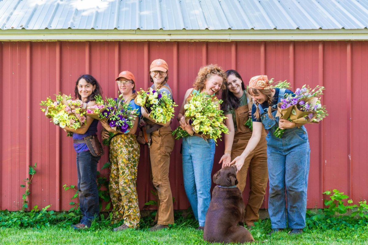 Delight Flower Farm's crew, including Toria Baez, Celeste Chandler, Kiki Koncel, Maggie Taylor, Remington Rock, Lauren White and the farm dog, Rosie, pose on the farm in 2023.
