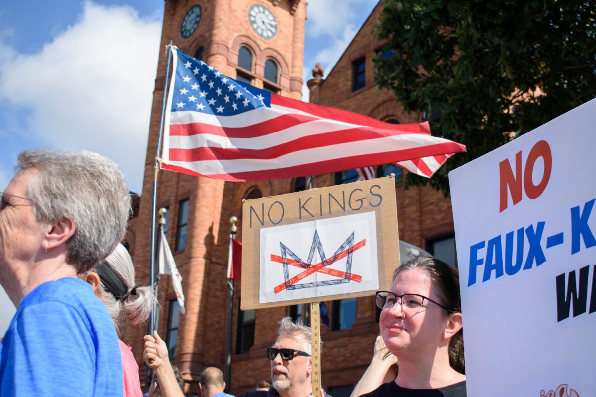 Hundreds of people march on Vine Street back toward the Champaign County Court House on Saturday. Despite being out in the heat for an hour and a half, the crowd was passionate and full of energy.