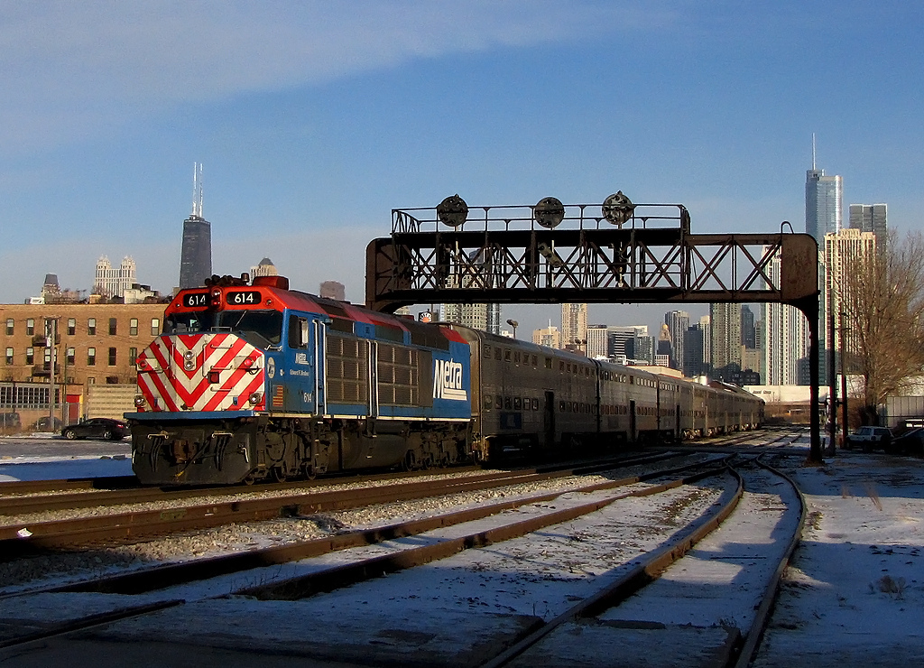 Metra 614 pushes a soon to be outbound commuter train into Union Station under the position lights at Racine Avenue on January 20, 2011.
