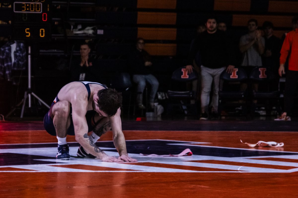 Redshirt senior Lucas Byrd acknowledges the crowd after his final regular-season win at Illinois' final dual meet of the season against No. 1 Penn State Sunday. Illinois lost the meet 29-9 with three individual wins by Byrd, graduate student Jason Kraisser and redshirt senior Luke Luffman.