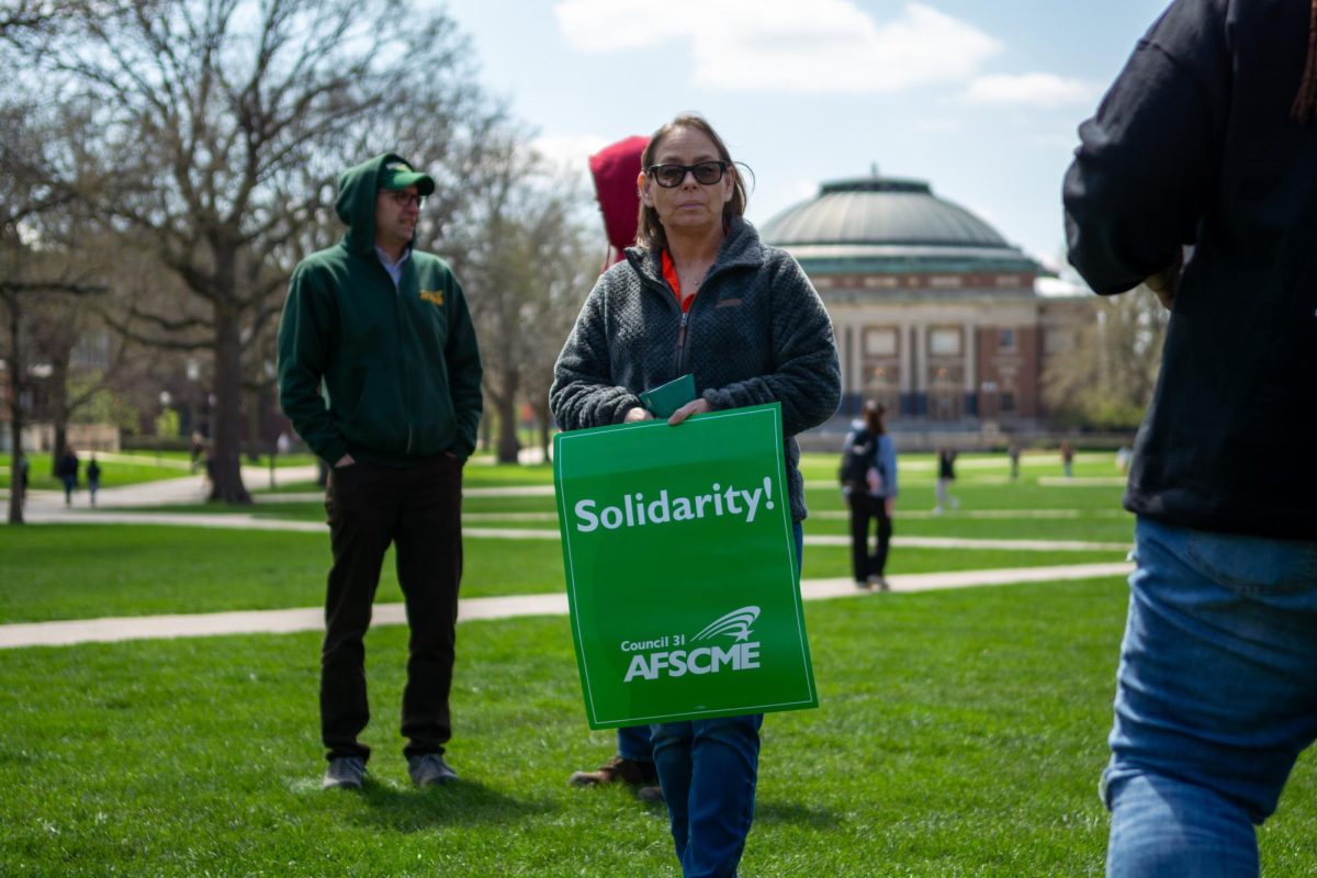 American Federation of State, County and Municipal Employees union members rally for a new contract on April 11. AFSCME Local 900 and the Champaign County Board Labor Committee reached a tentative contract deal on Tuesday.