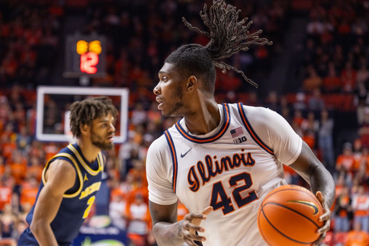 Redshirt junior #42 Dain Dainja handles the ball in a game against Michigan on Feb. 13, 2024.