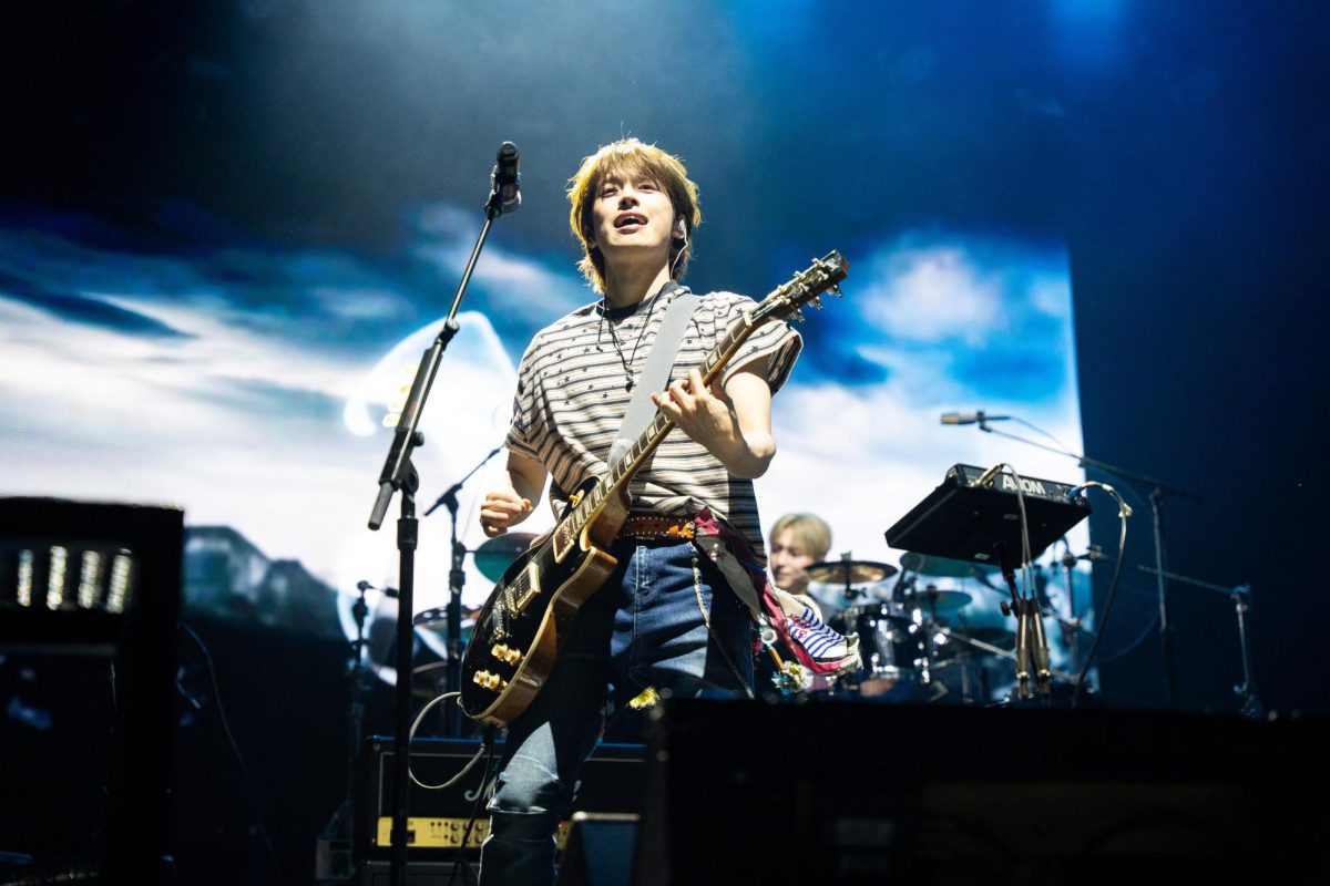 Lead singer of Xdinary Heroes Jun Han takes center stage with his electric guitar. The band had an electric performance on The Grove stage to finish out day 1 of Lollapalooza on July 31.