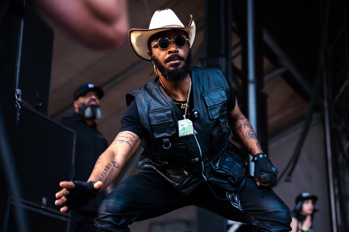 Barrington DeVaughn Hendricks, or JPEGMAFIA crouches down to interact with the crowd during his set on Lakeshore stage on day 3 of Lollapalooza.