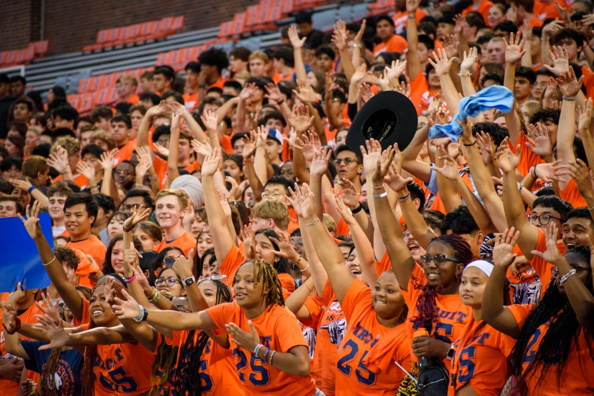 One highlight of Sights and Sounds for many students is the free swag they are given throughout the night. Students reach out as members of various athletic teams toss Illinois merch into the stands.