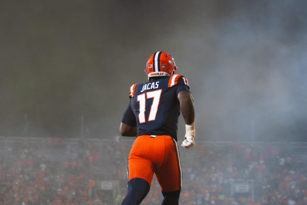 Outside linebacker Gabe Jacas runs onto the field before Illinois' game against Eastern Illinois on Aug. 29, 2024.