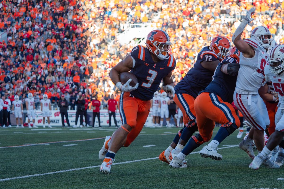 Running back Kaden Feagin runs the ball toward the South endzone in the second quarter of the Illinois versus Wisconsin football game on Oct. 21, 2023.