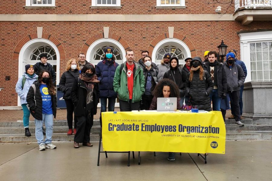 Members of the Graduate Employees’ Organization stand at a press conference on the Main Quad in 2023. The GEO and the University reached a tentative deal to incorporate research assistants into their collective bargaining agreement on Aug. 25.
