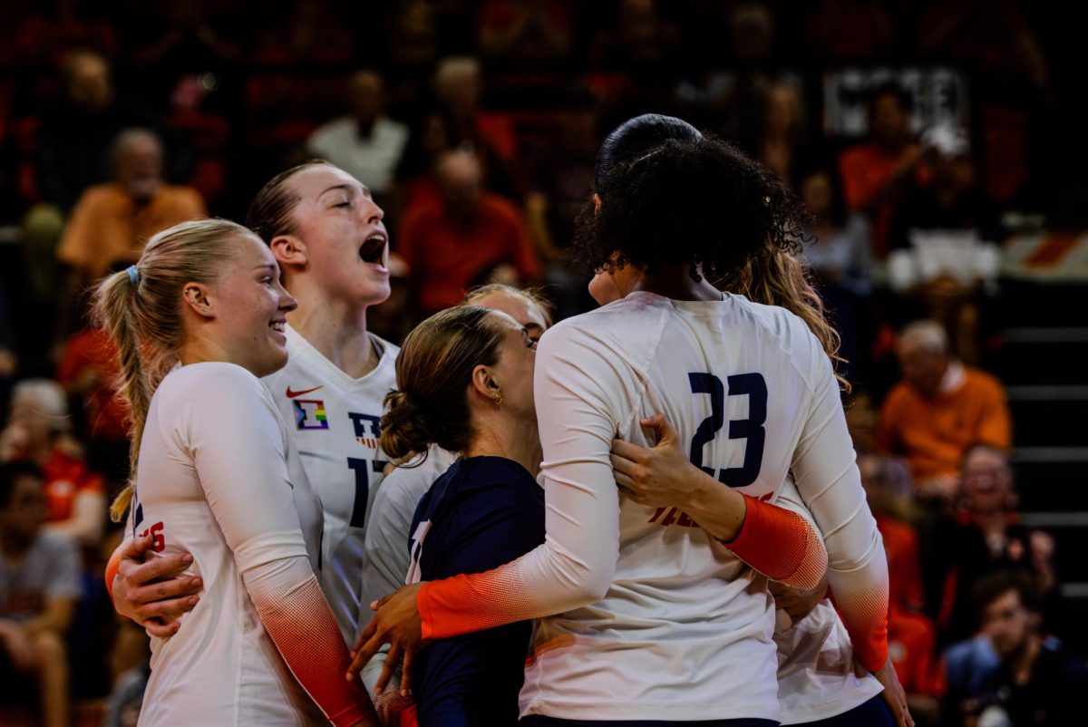 Illinois volleyball players celebrate during their match against Illinois State on Sept. 3, 2024.